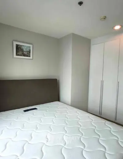 Modern bedroom with minimalist design and built-in wardrobe