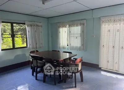 Charming dining area with natural light and cozy decor