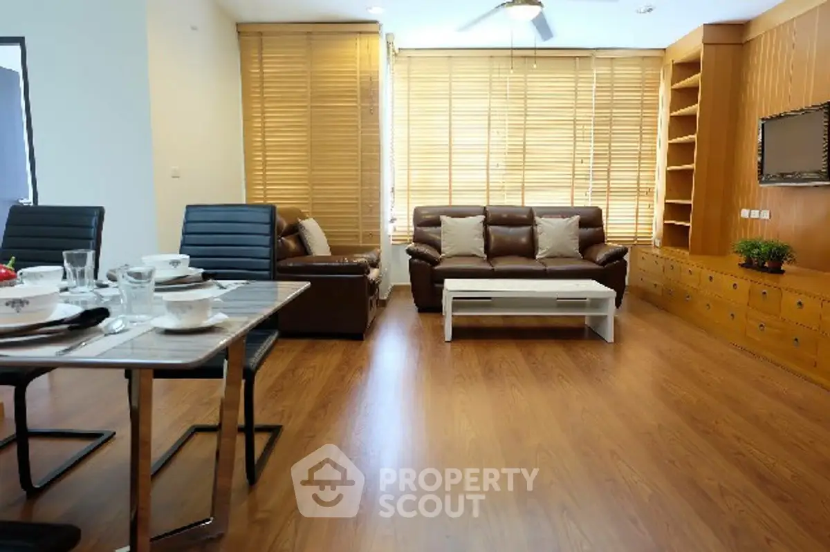 Spacious living room with modern furniture and wooden flooring