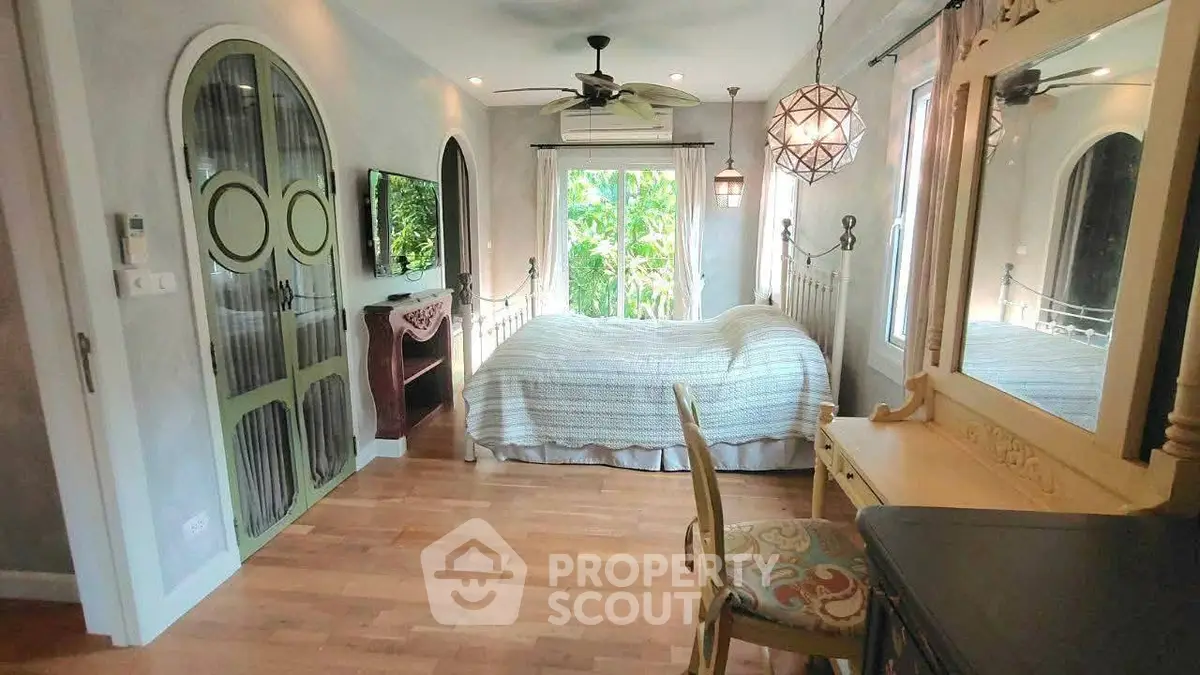 Charming bedroom with vintage decor and garden view