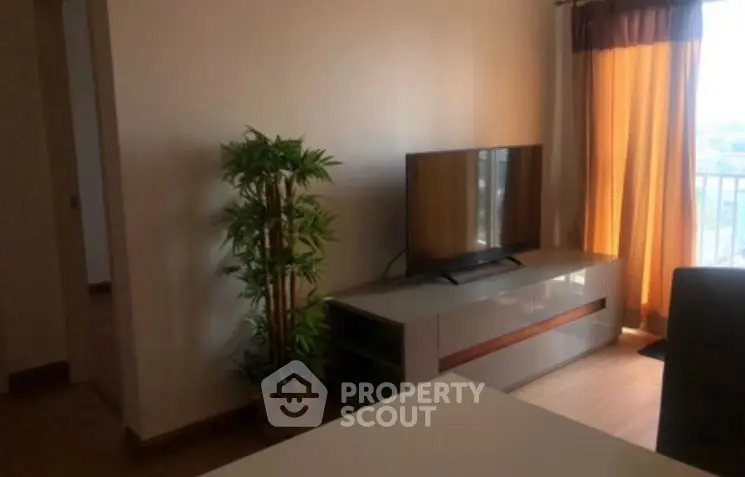 Cozy living room with modern TV stand and natural light