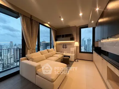 Luxurious modern living room with panoramic city views and elegant furnishings.