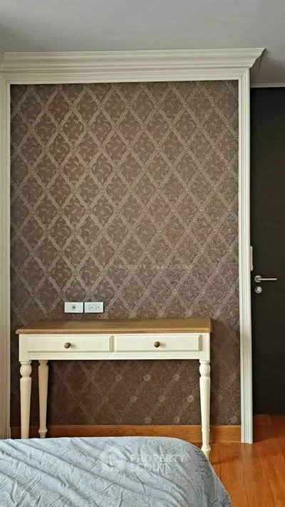 Elegant bedroom with classic wallpaper and wooden furniture