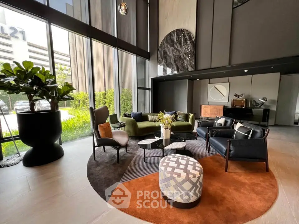 Luxurious modern lobby with stylish seating and large windows offering natural light.