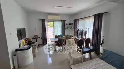 Spacious living room with natural light and modern furnishings