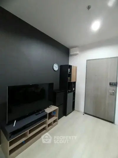Modern living room with sleek TV setup and minimalist decor
