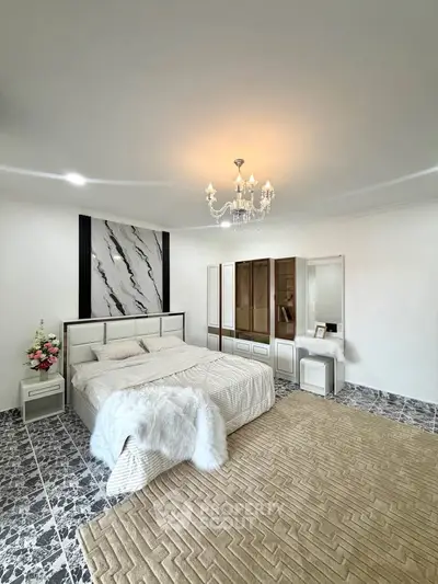 Luxurious bedroom with elegant chandelier and modern decor