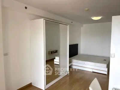 Spacious bedroom with modern wardrobe and minimalist design