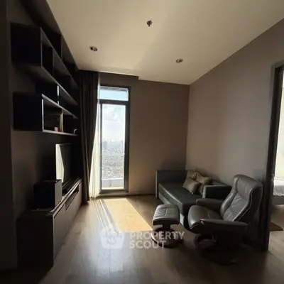 Modern living room with city view, sleek furniture, and natural light.