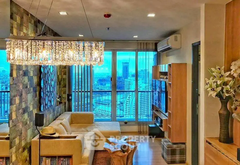 Luxurious living room with stunning city view and elegant chandelier