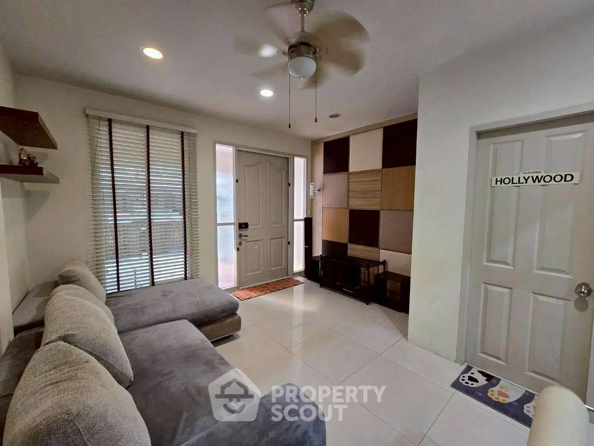 Stylish living room with modern sectional sofa and unique wall decor