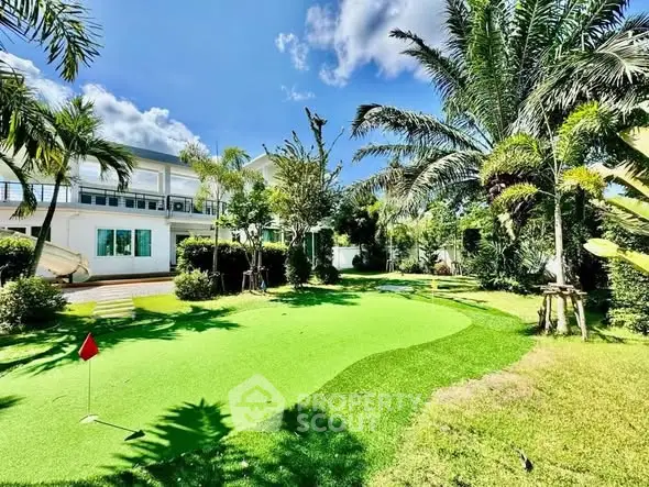 Luxurious villa with private putting green and lush tropical garden
