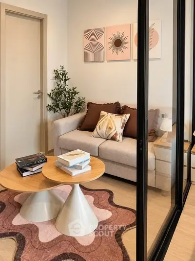 Stylish modern living room with cozy sofa and artistic decor in a chic apartment.