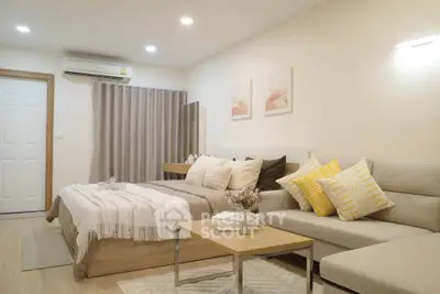 Modern cozy bedroom with stylish decor and comfortable seating area