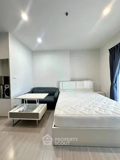 Modern studio apartment with sleek furniture and natural light