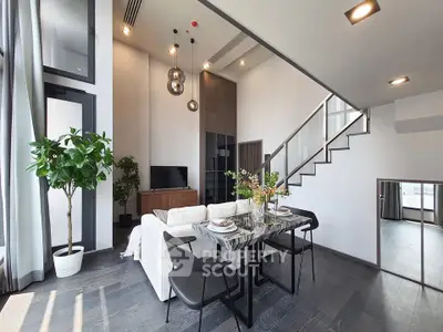 Modern duplex living room with high ceilings and stylish decor