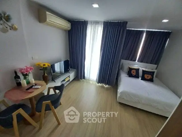 Cozy modern bedroom with stylish decor and natural light