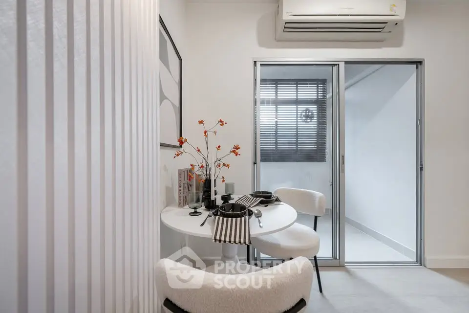 Chic dining area with modern decor and air conditioning, perfect for cozy meals.