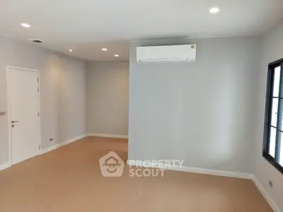 Spacious empty room with modern air conditioning and elegant lighting