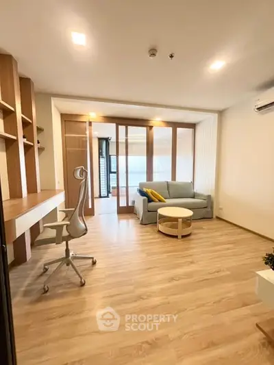 Modern living room with stylish furniture and wooden flooring