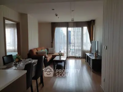 Spacious living room with modern decor and city view, perfect for urban living.