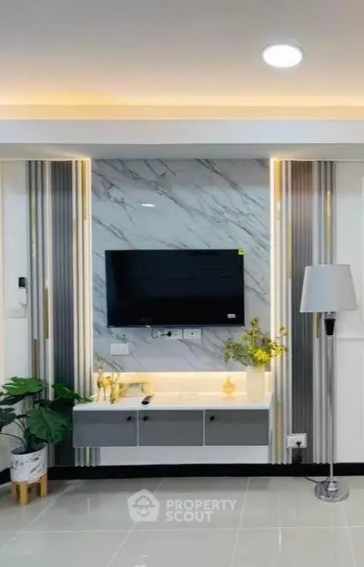 Modern living room with sleek TV setup and elegant decor