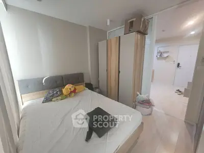 Cozy bedroom with modern decor and ample storage space