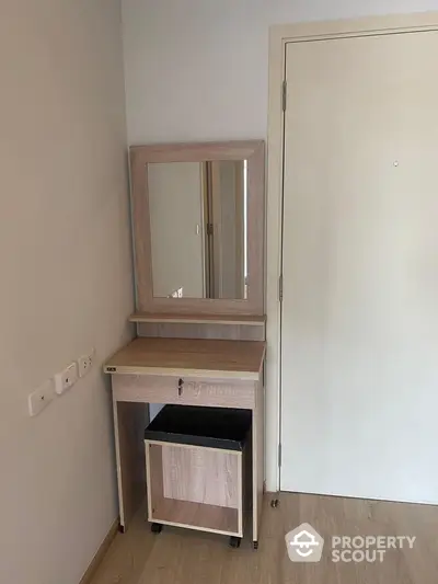 Modern bedroom corner with stylish vanity table and mirror