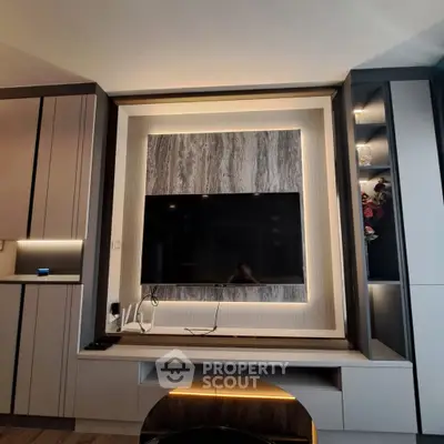 Modern living room with sleek TV wall unit and ambient lighting