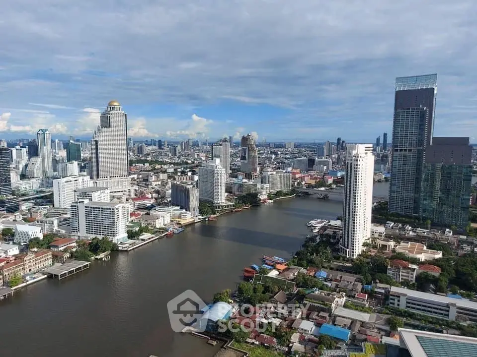 Stunning cityscape view with river and skyscrapers under a clear blue sky.