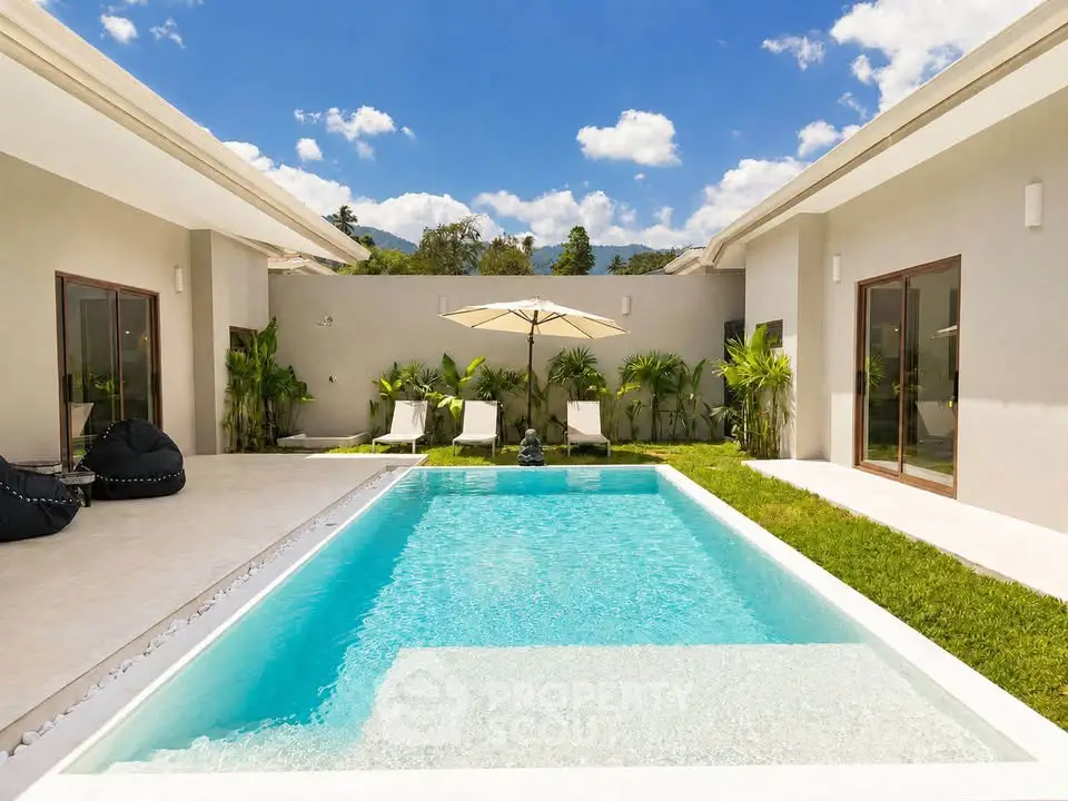 Luxurious modern villa with private pool and lush garden, perfect for relaxation and entertainment.