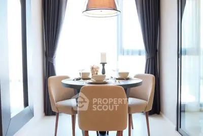 Elegant dining area with modern decor and natural light