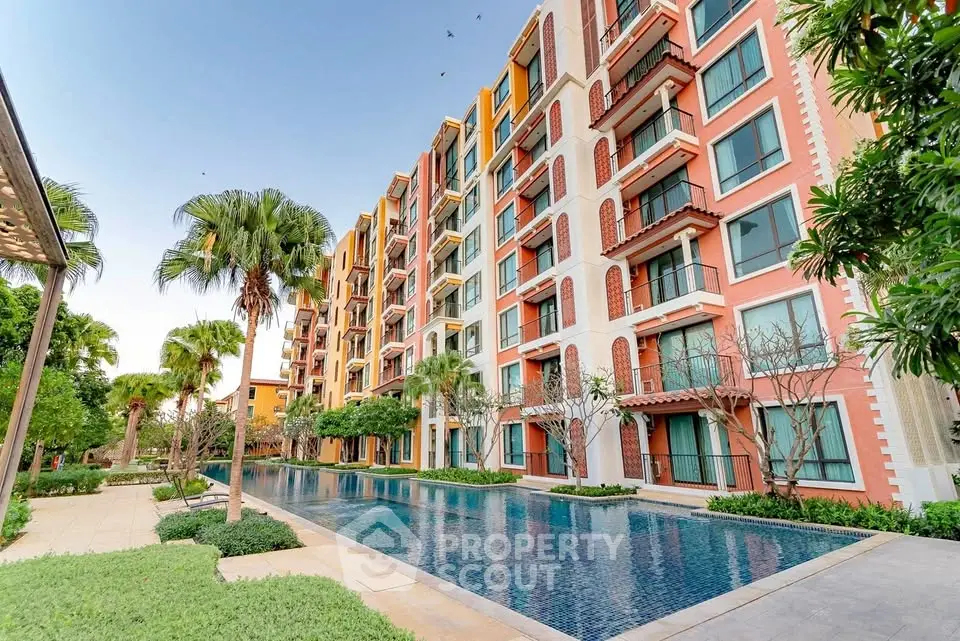 Luxurious apartment building with stunning pool and lush greenery