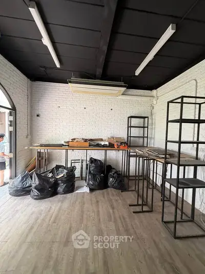 Spacious commercial space with modern industrial design and ample storage potential.
