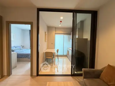 Modern apartment interior with cozy living room, stylish kitchen, and inviting bedroom.