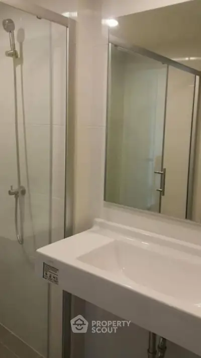 Modern bathroom with sleek shower and elegant sink design