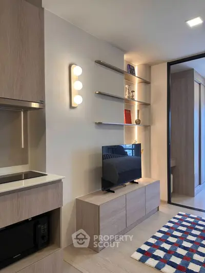 Modern living room with sleek wooden furniture and stylish shelving, perfect for contemporary urban living.
