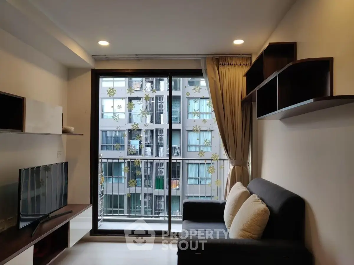 Modern living room with balcony view in urban apartment