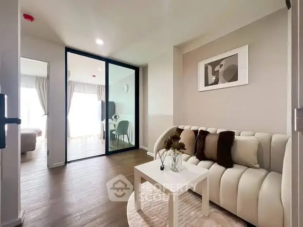 Modern living room with elegant decor and glass partition in stylish apartment