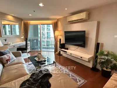 Spacious living room with modern decor and balcony view in luxury apartment