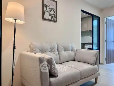 Cozy living room with modern sofa and stylish decor in a contemporary apartment.