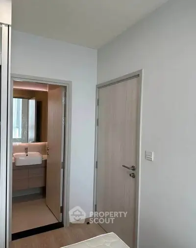 Modern minimalist bathroom with sleek fixtures and neutral tones