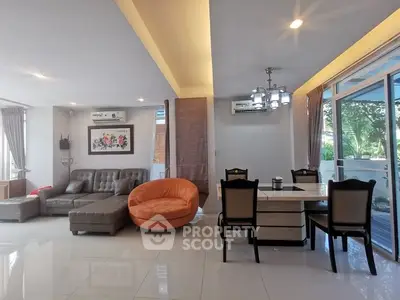 Spacious modern living room with elegant dining area and stylish furniture