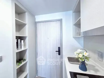 Modern kitchen with sleek cabinetry and elegant decor in a compact space