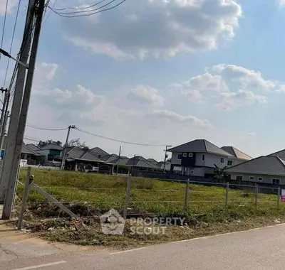 Scenic view of residential neighborhood with modern houses and open land