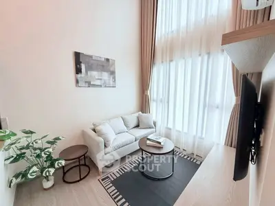 Modern living room with high ceilings and elegant decor