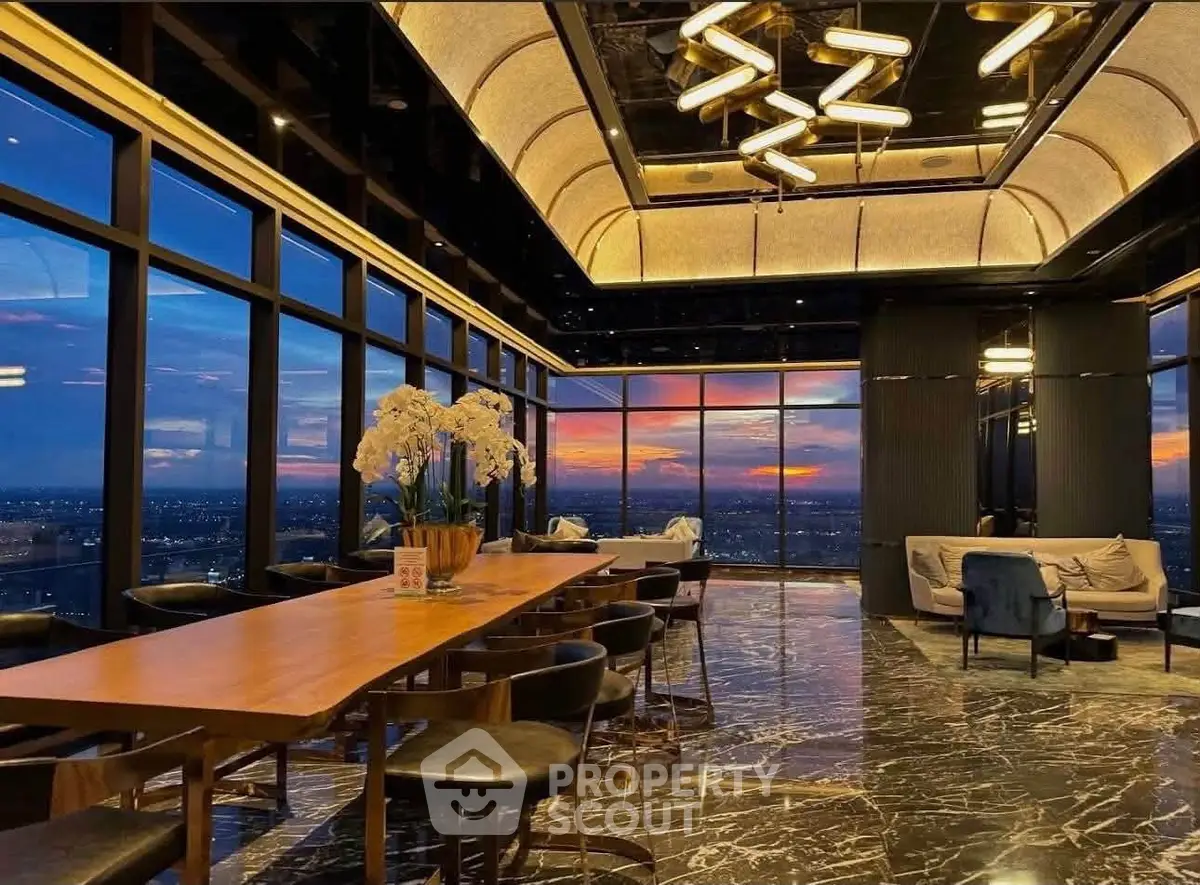 Luxurious high-rise building interior with stunning sunset view and elegant marble flooring.