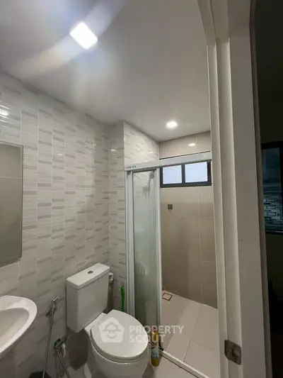 Modern bathroom with shower and sleek tile design