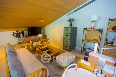 Charming attic living room with modern furniture and cozy ambiance