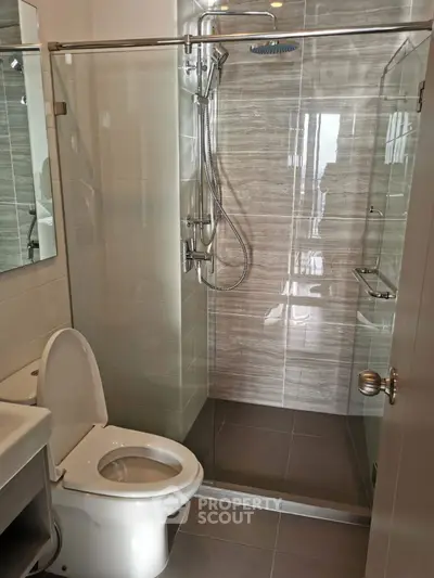 Modern bathroom with glass shower and sleek fixtures